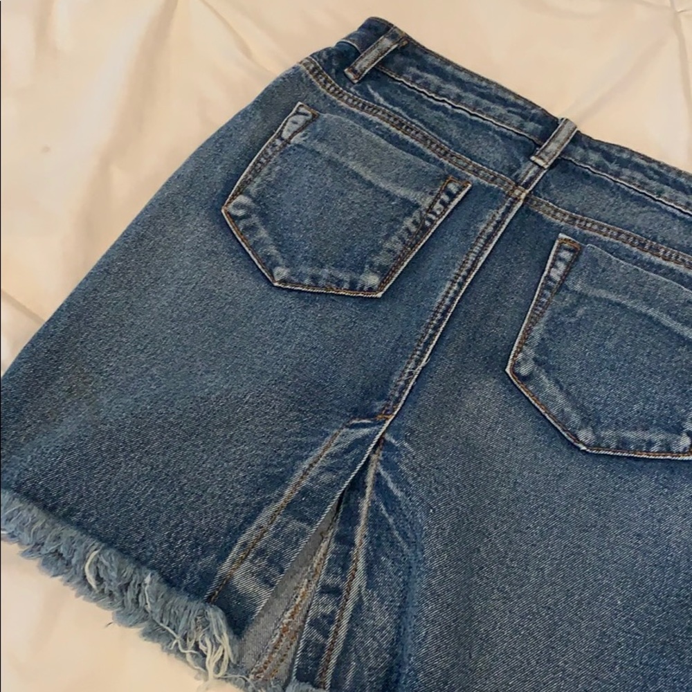 Distressed denim skirt with slit in the back